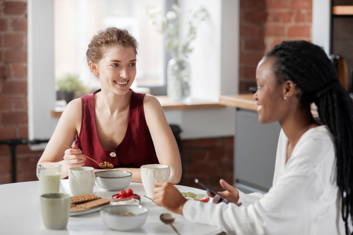 Guests sharing a healthy breakfast and conversation